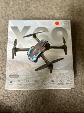 X69 Foldable Drone with Blue and Orange Accents
